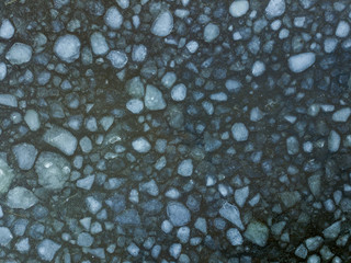 Aerial view the ice floes and open water on the lake in winter