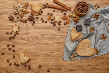 Background with homemade cakes, fragrant cookies. Cookies in the form of hearts, stars, coffee beans, spices, almonds close-up. menu concept, Home baking. Full size