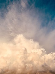 white cumulus clouds against deep blue sky