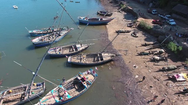 Traditional Pirogue Wooden Sail Boats docked in Madagascar. Aerial of Village Harbour in Nosy Be.