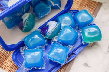 Fototapeta premium Washing Capsules. For washing Laundry or dishwasher, gel for household use. A lot of multicolored capsules for washing.