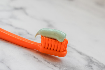 Toothbrush head with green paste