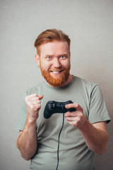 handsome man making great efforts to win a video game