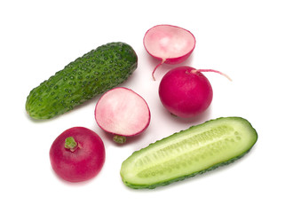 Cucumber and radish, their halfs isolated on a white background