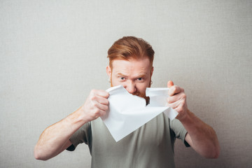 Businessman Young red bearded man in casual tear contract
