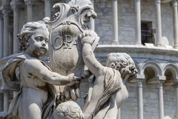 Fototapeta na wymiar La Fontana dei Putti di Pisa, Piazza dei Miracoli, Pisa, Italy.