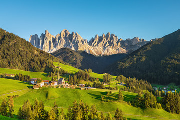 Fototapeta na wymiar Famous alpine place Santa Maddalena village with magical Dolomites mountains in background, Val di Funes valley, Trentino Alto Adige region, Italy