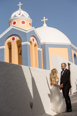 Beautiful wedding couple posing in city