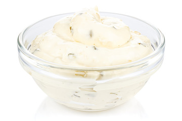 Tartar sauce with onions and pickled cucumbers in a small transparent glass round bowl isolated on white background