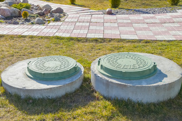 manhole sewer cleaning system on the ground on a Sunny spring day