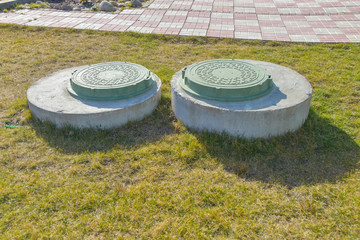 manhole sewer cleaning system on the ground on a Sunny spring day
