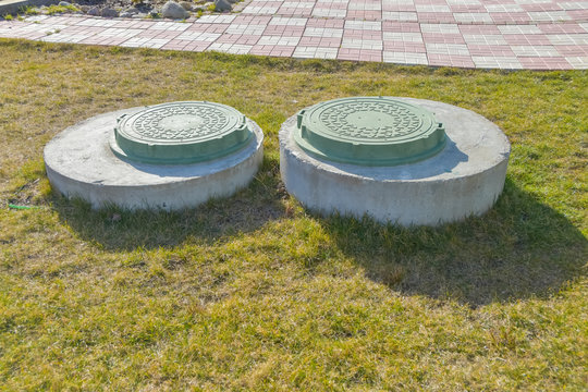 manhole sewer cleaning system on the ground on a Sunny spring day