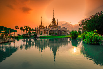Fototapeta na wymiar Wallpaper Wat Lan Boon Mahawihan Somdet Phra Buddhacharn(Wat Non Kum)is the beauty of the church that reflects the surface of the water,popular tourists come to make merit and take a public photo