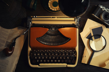 Flat lay composition with vintage detective items on dark wooden background