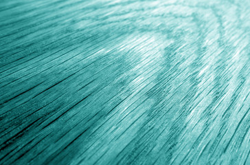 Wooden board texture with blur effect in cyan tone.