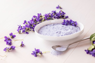 Fototapeta na wymiar viola violet violetta odorata fresh petal sugar bath spa salts from spring blossom flowers 