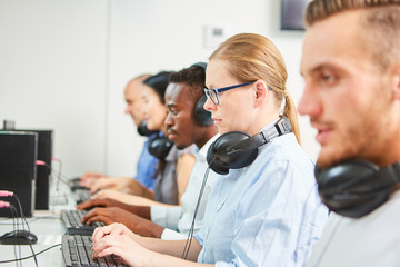 Colleagues work side by side on the computer