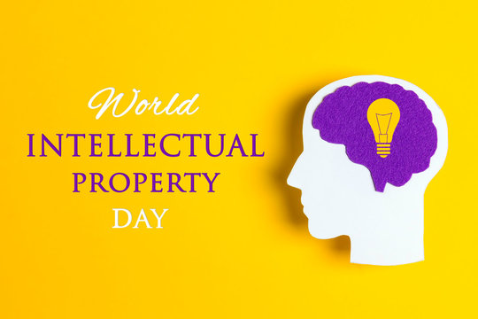 World Intellectual Property Day, april 26. Poster with head silhouette with a purple brain and light bulb.