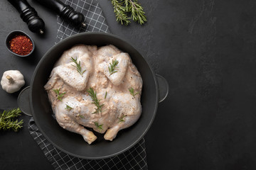 Fresh Pickled Chicken on black background. View from above.