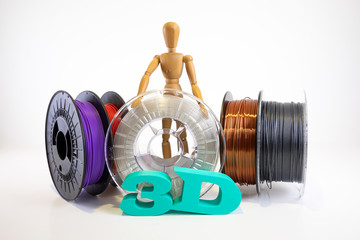 3D printing filament reels with wooden anthropomorphic doll with text 