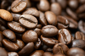 Top view of brown roasted coffee beans, can be use as background, copy space for text.