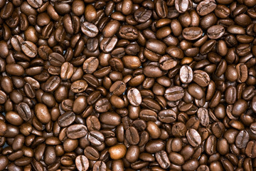 Top view of brown roasted coffee beans, can be use as background, copy space for text.