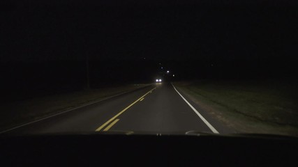 Passenger POV With Cars Passing On Country Road At Night