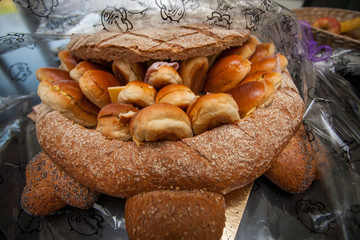  Bunch of sliced French breads and sandwiches in a basket. 