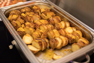 Delicious golden potatoes in special dish
