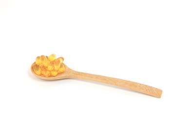 Omega 3 capsules in spoon on white background which Fish oil in pills. Health support and treatment. Biologically active additives