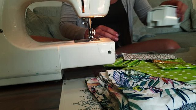 A Woman Sewing DIY Facemasks Out Of Old Clothes During The Coronavirus Outbreak - Slow Motion