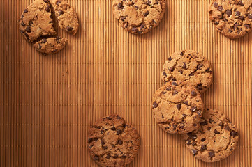 Obraz na płótnie Canvas Chocolate chip cookies on a wooden background.