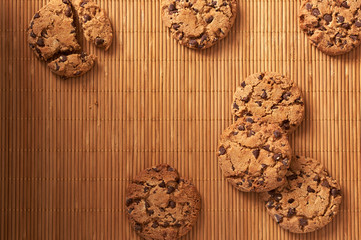 
Chocolate chip cookies on a wooden background.