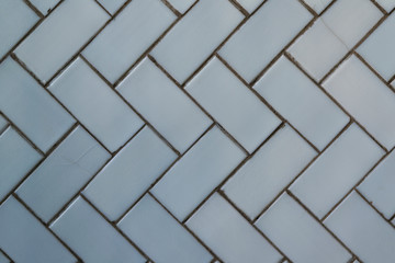 Blue glossy tile masonry pattern close-up