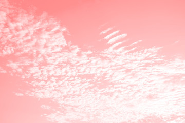 Vanilla strawberry sky with beautiful clouds, pink color tinted background.