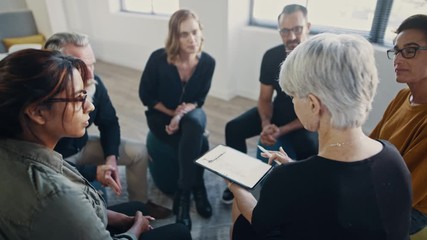 Groups of business professionals sitting in a circle and discussing. Coach conducting a professional negotiation and influencing skills training program with employees.
- Powered by Adobe
