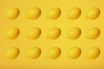 Top view of fresh lemon isolated on yellow background. Fruit minimal concept, lemon pattern
