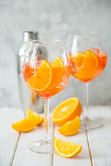 Aperol and ingredients drinks on wood background, copy space