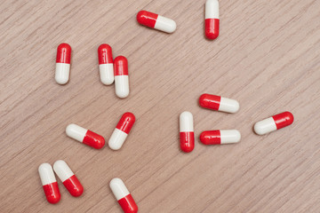 lots of red and white capsules, pills