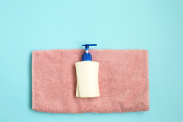 Soap dispenser with towel hygiene on blue background