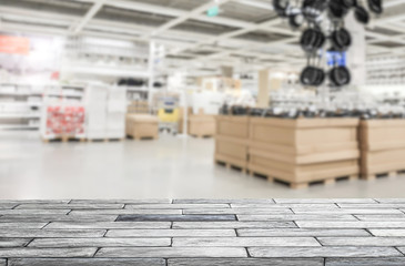 empty marble stone table top with blur abtract supermarket shopping mall in background