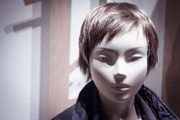 Young mannequin with short hair. Neutral expression