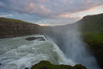 Iceland, Gullfoss waterfall. Captivating scene with rainbow of Gullfoss waterfall that is most powerful waterfall in Iceland and Europe. Picturesque summer scene with amazing Icelandic waterfall.