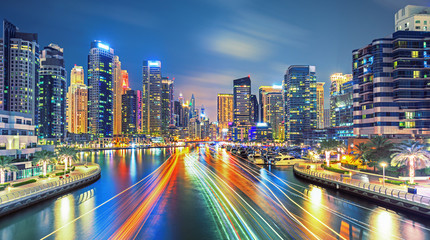 Obraz premium Modern and Luxury Dubai Marina with reflection - famous Jumeirah beach at sunrise, United Arab Emirates