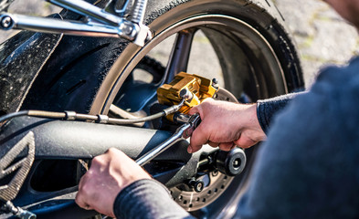 Mechanic working in garage. motorcycle Repair service.