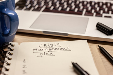crisis management plan written words in notebook - obrazy, fototapety, plakaty
