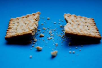 Tradicional Polish biscuits separated with crumbs and blue background
