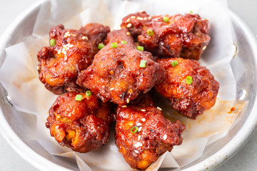 Closeup of fried chicken Korean Sauce with onions and spices