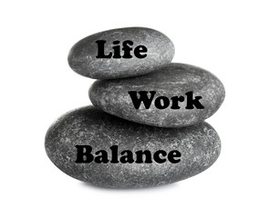 Work-life balance concept. Stacked stones on white background