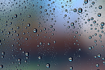 gray wet background / raindrops to overlay on the window, weather, background drops of water rain on the glass transparent